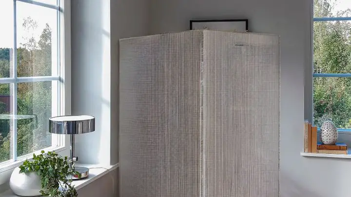 Use Repurposed Screens to hide water heater