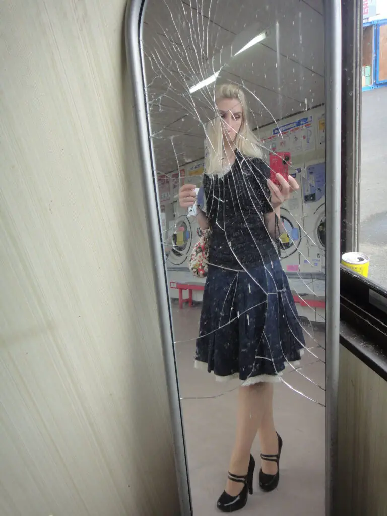 broken mirror pose